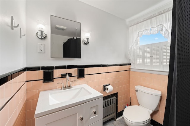 2 Glen Dr, Warwick, RI 02889 - full bath with vanity, radiator heating unit, tile walls, wainscoting, and a shower with curtain