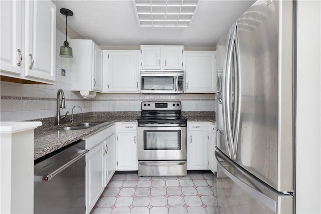 26 Pheasant Run Unit A, Smithfield, RI 02917 - kitchen with stainless steel appliances, white cabinetry, and dark stone counters