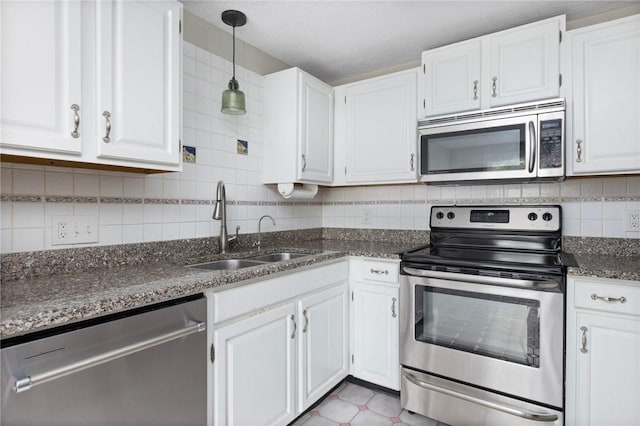 26 Pheasant Run Unit A, Smithfield, RI 02917 - kitchen with stainless steel appliances, white cabinets, tasteful backsplash, and dark stone counters