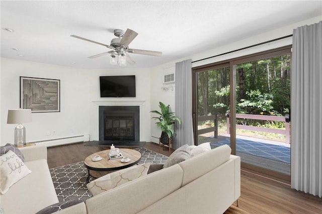 26 Pheasant Run Unit A, Smithfield, RI 02917 - living room with a baseboard radiator, wood finished floors, ceiling fan, and a glass covered fireplace
