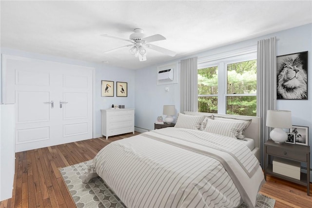 26 Pheasant Run Unit A, Smithfield, RI 02917 - bedroom featuring hardwood / wood-style flooring, a wall mounted AC, and a ceiling fan