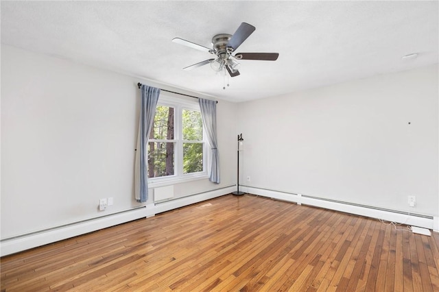 26 Pheasant Run Unit A, Smithfield, RI 02917 - spare room featuring hardwood / wood-style floors, ceiling fan, and a baseboard radiator