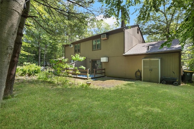 26 Pheasant Run Unit A, Smithfield, RI 02917 - back of property with a lawn, an AC wall unit, and a shingled roof