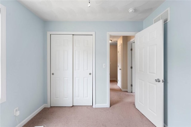 174 Long St, Warwick, RI 02886 - unfurnished bedroom featuring light colored carpet and a closet
