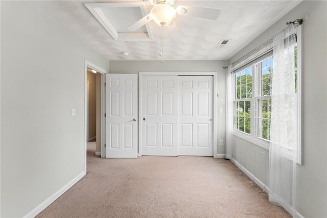 174 Long St, Warwick, RI 02886 - unfurnished bedroom with light colored carpet, a closet, and ceiling fan