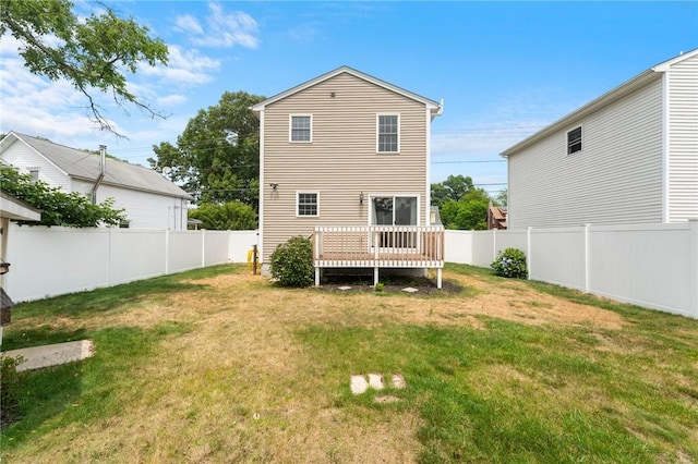 174 Long St, Warwick, RI 02886 - back of property with a fenced backyard and a deck