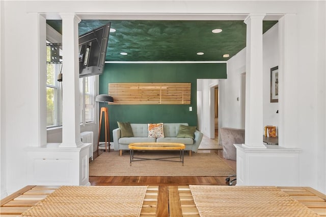 61 Wealth Ave, Providence, RI 02908 - living room with ornate columns, wood finished floors, radiator heating unit, and recessed lighting