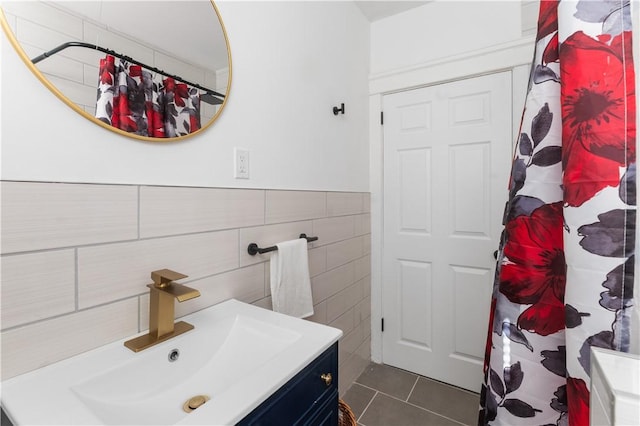 61 Wealth Ave, Providence, RI 02908 - full bathroom featuring vanity, tile walls, tile patterned flooring, a shower with curtain, and a wainscoted wall