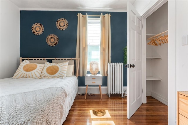 61 Wealth Ave, Providence, RI 02908 - bedroom featuring radiator and wood finished floors