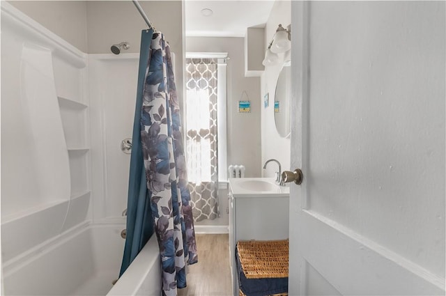 61 Wealth Ave, Providence, RI 02908 - full bath featuring healthy amount of natural light, shower / tub combo, vanity, and wood finished floors