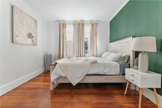 61 Wealth Ave, Providence, RI 02908 - bedroom featuring radiator heating unit and wood finished floors