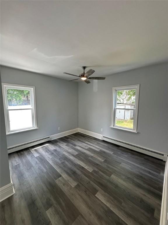 208 Carnation St, Pawtucket, RI 02860 - unfurnished room featuring baseboard heating, healthy amount of natural light, and dark wood finished floors