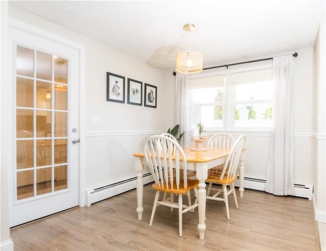 94 Osage Dr, Warwick, RI 02888 - dining area featuring baseboard heating and light wood finished floors