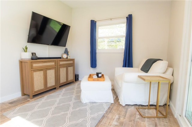 94 Osage Dr, Warwick, RI 02888 - living area featuring light wood-style flooring and baseboards