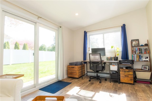 94 Osage Dr, Warwick, RI 02888 - home office with wood finished floors, plenty of natural light, vaulted ceiling, recessed lighting, and baseboard heating