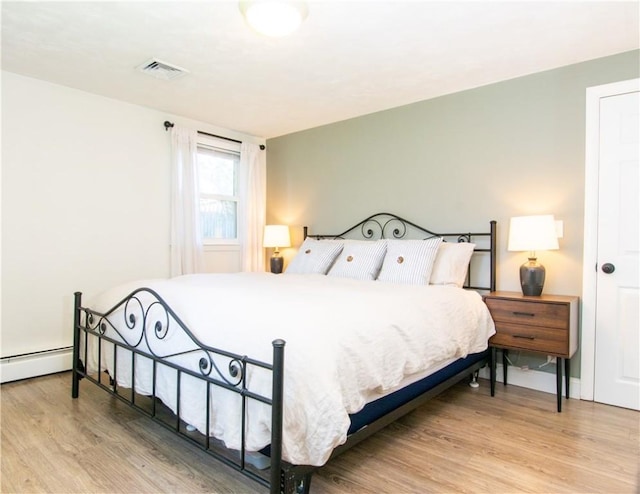 94 Osage Dr, Warwick, RI 02888 - bedroom with wood finished floors and baseboard heating