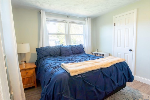 94 Osage Dr, Warwick, RI 02888 - bedroom with light wood-type flooring and baseboards