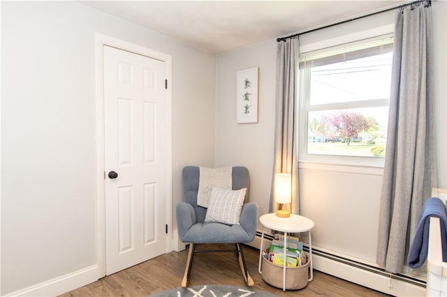 94 Osage Dr, Warwick, RI 02888 - sitting room featuring a baseboard radiator and wood finished floors