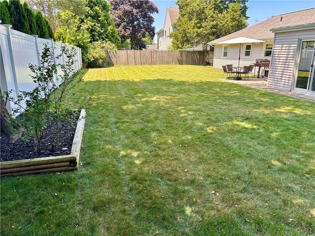 94 Osage Dr, Warwick, RI 02888 - fenced backyard with a garden and a patio