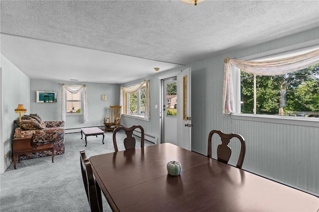 33 Limestone St, Warwick, RI 02889 - carpeted dining area featuring baseboard heating and a textured ceiling