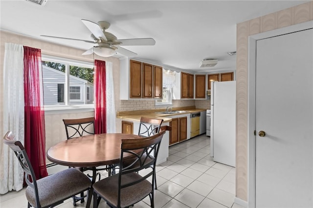33 Limestone St, Warwick, RI 02889 - dining area with ceiling fan and light tile patterned floors