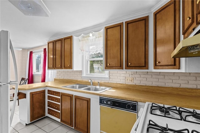 33 Limestone St, Warwick, RI 02889 - kitchen featuring white appliances, under cabinet range hood, light countertops, and brown cabinets