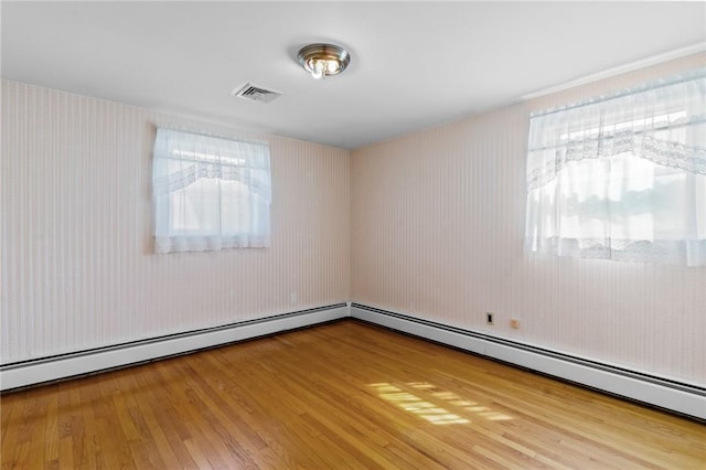 33 Limestone St, Warwick, RI 02889 - spare room with wood finished floors and a baseboard radiator