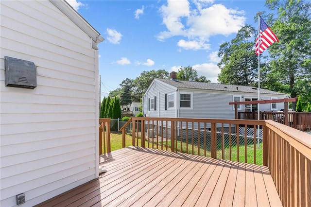 33 Limestone St, Warwick, RI 02889 - wooden deck featuring a lawn