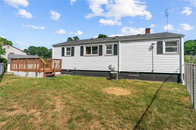 33 Limestone St, Warwick, RI 02889 - rear view of house with a fenced backyard, a wooden deck, and a chimney
