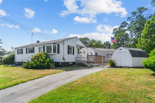 33 Limestone St, Warwick, RI 02889 - view of front of property with a shed and a front lawn