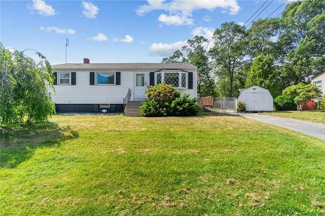 33 Limestone St, Warwick, RI 02889 - manufactured / mobile home featuring a storage shed and a chimney