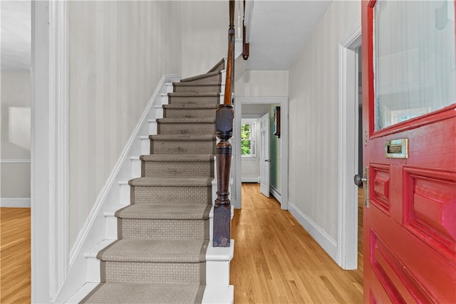 303 Washington Rd, Barrington, RI 02806 - entryway featuring light wood finished floors, stairway, and baseboard heating