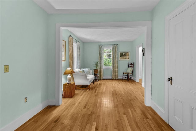 303 Washington Rd, Barrington, RI 02806 - corridor with light wood-type flooring and baseboard heating