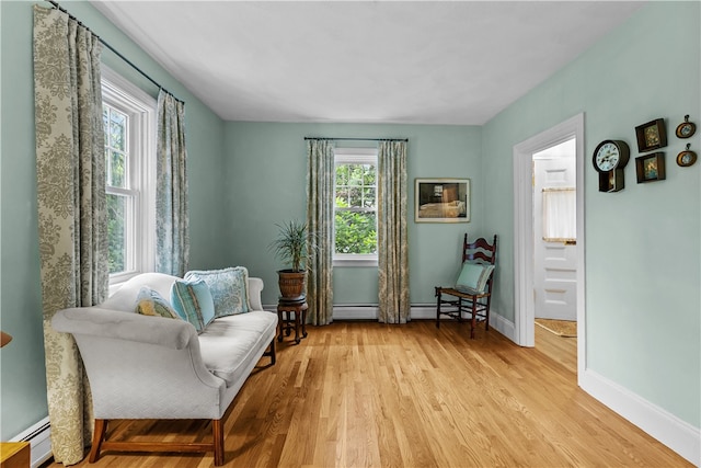 303 Washington Rd, Barrington, RI 02806 - sitting room with light wood-style floors, a baseboard heating unit, and baseboard heating