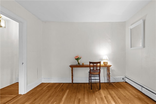 303 Washington Rd, Barrington, RI 02806 - home office with a baseboard heating unit and wood finished floors