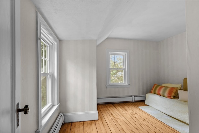 303 Washington Rd, Barrington, RI 02806 - bedroom featuring a baseboard heating unit and wood-type flooring