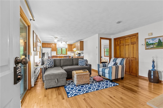 303 Washington Rd, Barrington, RI 02806 - living area with light wood-type flooring and a ceiling fan
