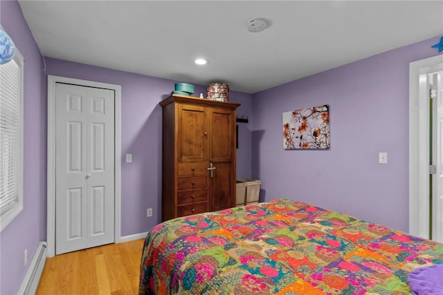 37 Ridge Rd, East Greenwich, RI 02818 - bedroom with baseboard heating, light wood finished floors, recessed lighting, and a closet