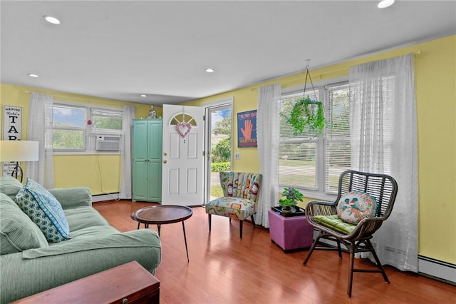 37 Ridge Rd, East Greenwich, RI 02818 - living room featuring baseboard heating, wood finished floors, cooling unit, and recessed lighting