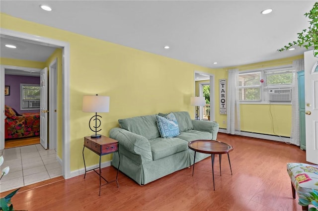 37 Ridge Rd, East Greenwich, RI 02818 - living area with a baseboard radiator, cooling unit, wood finished floors, and recessed lighting
