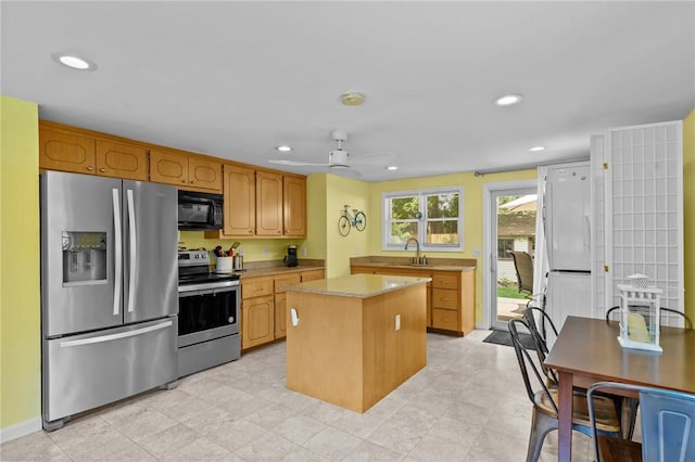 37 Ridge Rd, East Greenwich, RI 02818 - kitchen featuring stainless steel appliances, light countertops, a center island, recessed lighting, and ceiling fan