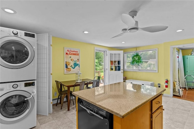 37 Ridge Rd, East Greenwich, RI 02818 - kitchen featuring black dishwasher, estacked washer and dryer, light tile patterned flooring, a center island, and recessed lighting
