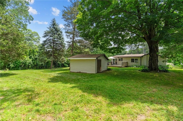 37 Ridge Rd, East Greenwich, RI 02818 - view of grassy yard with a storage unit and a wooden deck