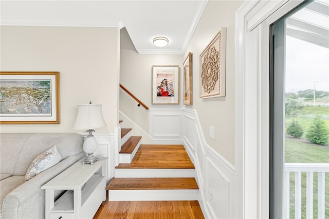 2 Sydney Rose Ct Unit B, Johnston, RI 02919 - staircase featuring ornamental molding, a decorative wall, wood finished floors, and a wainscoted wall