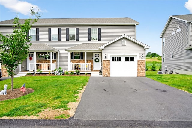 2 Sydney Rose Ct Unit B, Johnston, RI 02919 - view of front of home with a porch, a front lawn, stone siding, an attached garage, and asphalt driveway