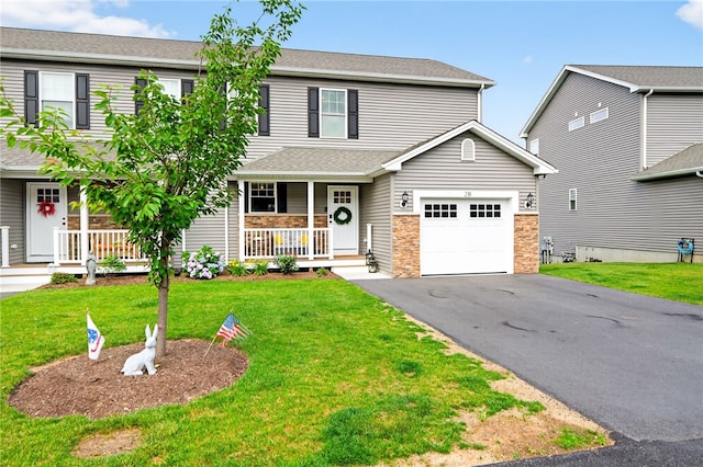 2 Sydney Rose Ct Unit B, Johnston, RI 02919 - traditional home with a porch, asphalt driveway, stone siding, a front lawn, and a garage
