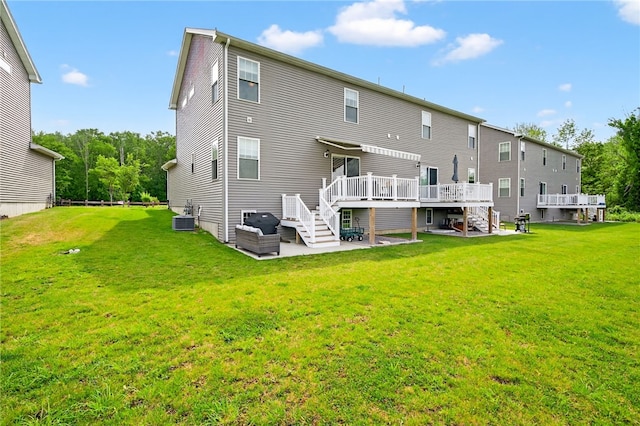 2 Sydney Rose Ct Unit B, Johnston, RI 02919 - back of property featuring a wooden deck, stairway, and a lawn