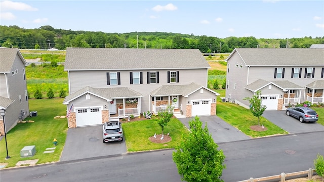 2 Sydney Rose Ct Unit B, Johnston, RI 02919 - view of front of house with a porch, driveway, a front lawn, and stone siding