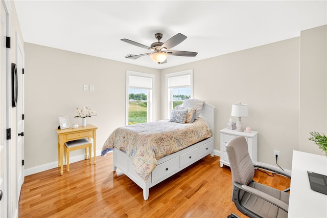 2 Sydney Rose Ct Unit B, Johnston, RI 02919 - bedroom with an office area, light wood-style flooring, and a ceiling fan