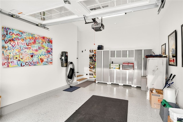 2 Sydney Rose Ct Unit B, Johnston, RI 02919 - garage with a garage door opener and a central vacuum unit